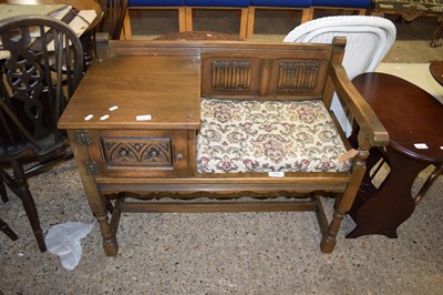 Lot 402 - OAK TELEPHONE SEAT WITH LINENFOLD DETAIL