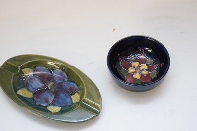 Lot 134 - Small Moorcroft pin dish with floral design on...