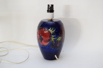 Lot 135 - Moorcroft table lamp with a tube lined floral...