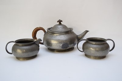 Lot 137 - Pewter Tudric tea pot, milk jug and sugar bowl...