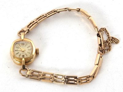 Lot 304 - A yellow metal ladies Emperor wristwatch on a...