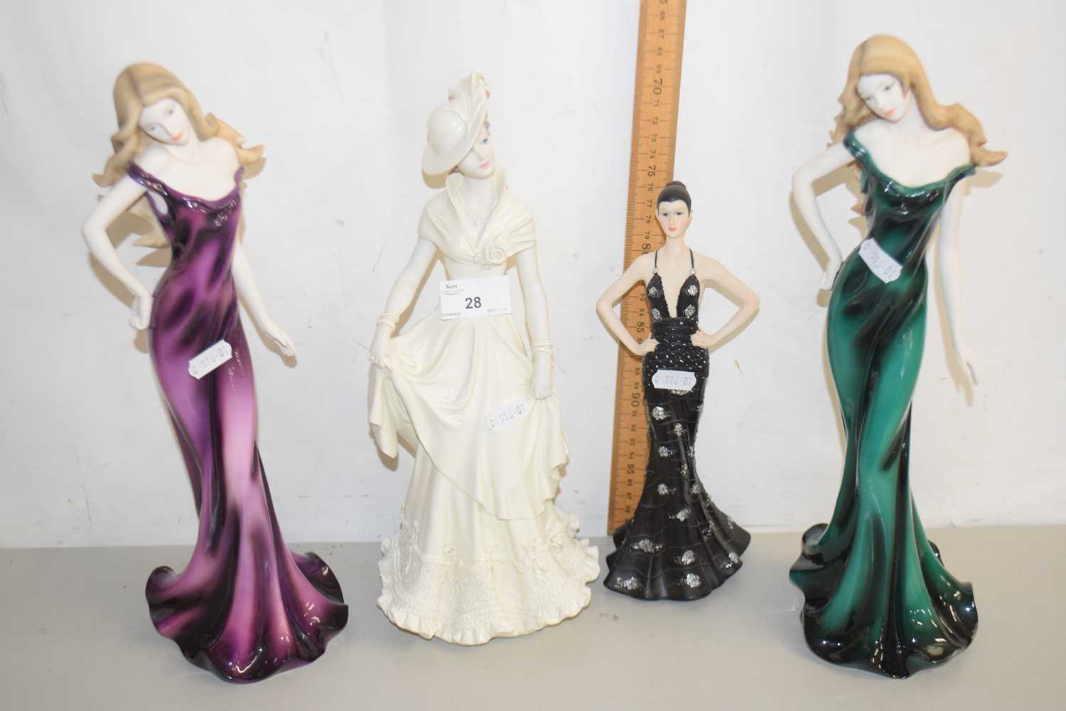 Lot 28 - A group of four modern figurines to include...