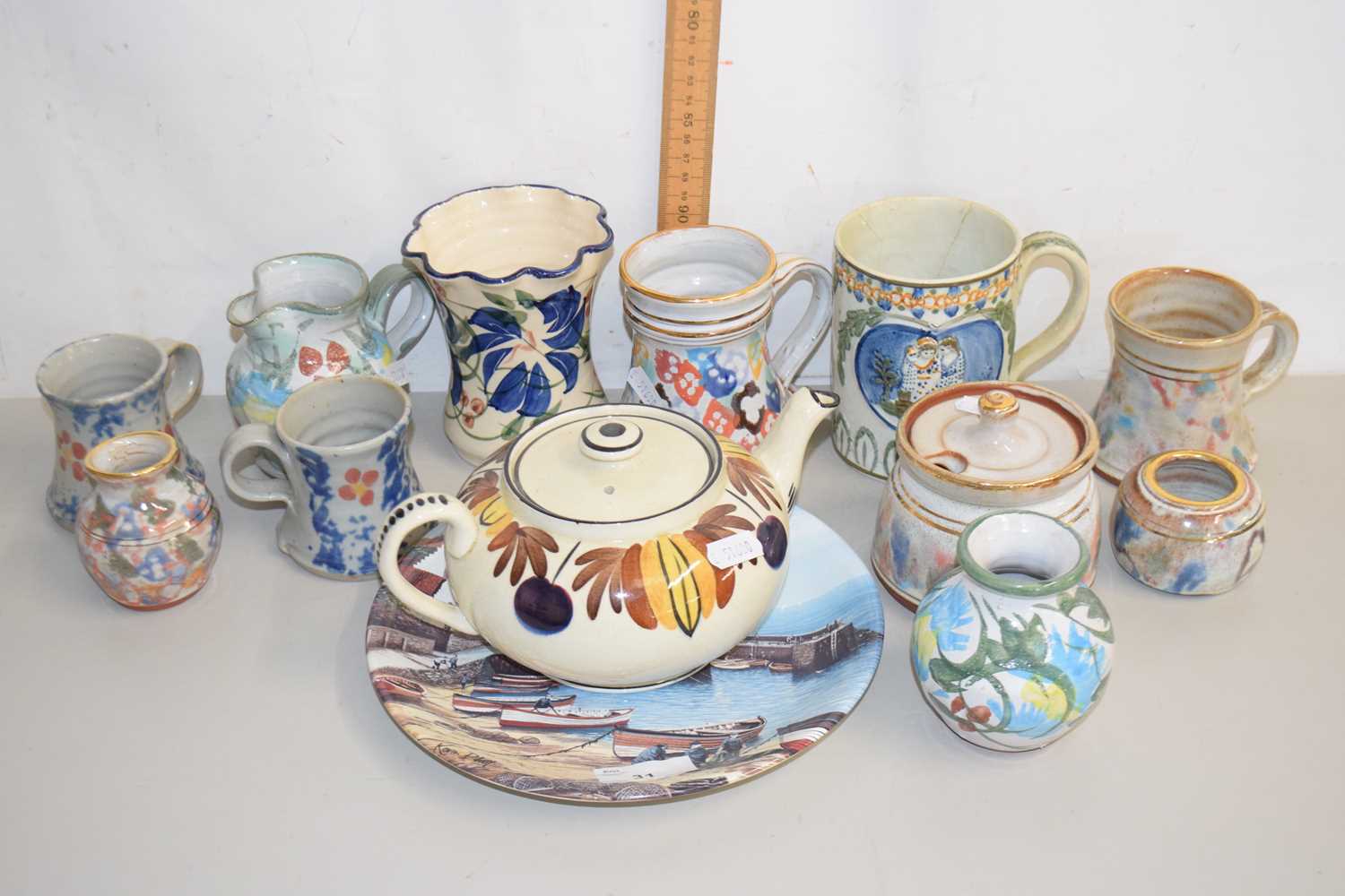 Lot 31 - A group of various modern pottery tankards,...