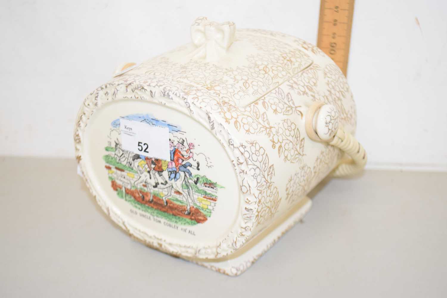 Lot 52 - An Uncle Tom Cobbly gilt decorated biscuit...