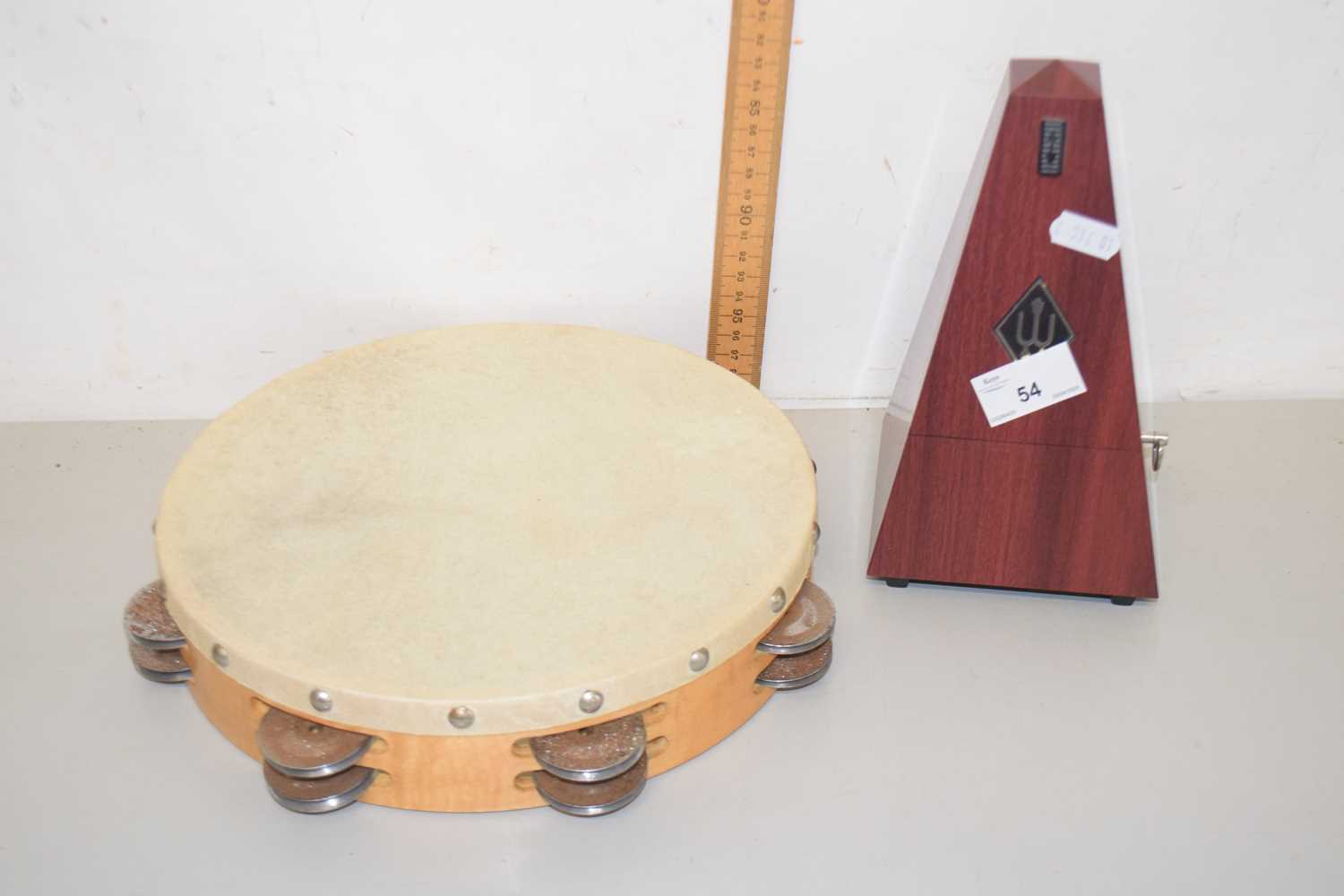 Lot 54 - A tambourine and a metronome