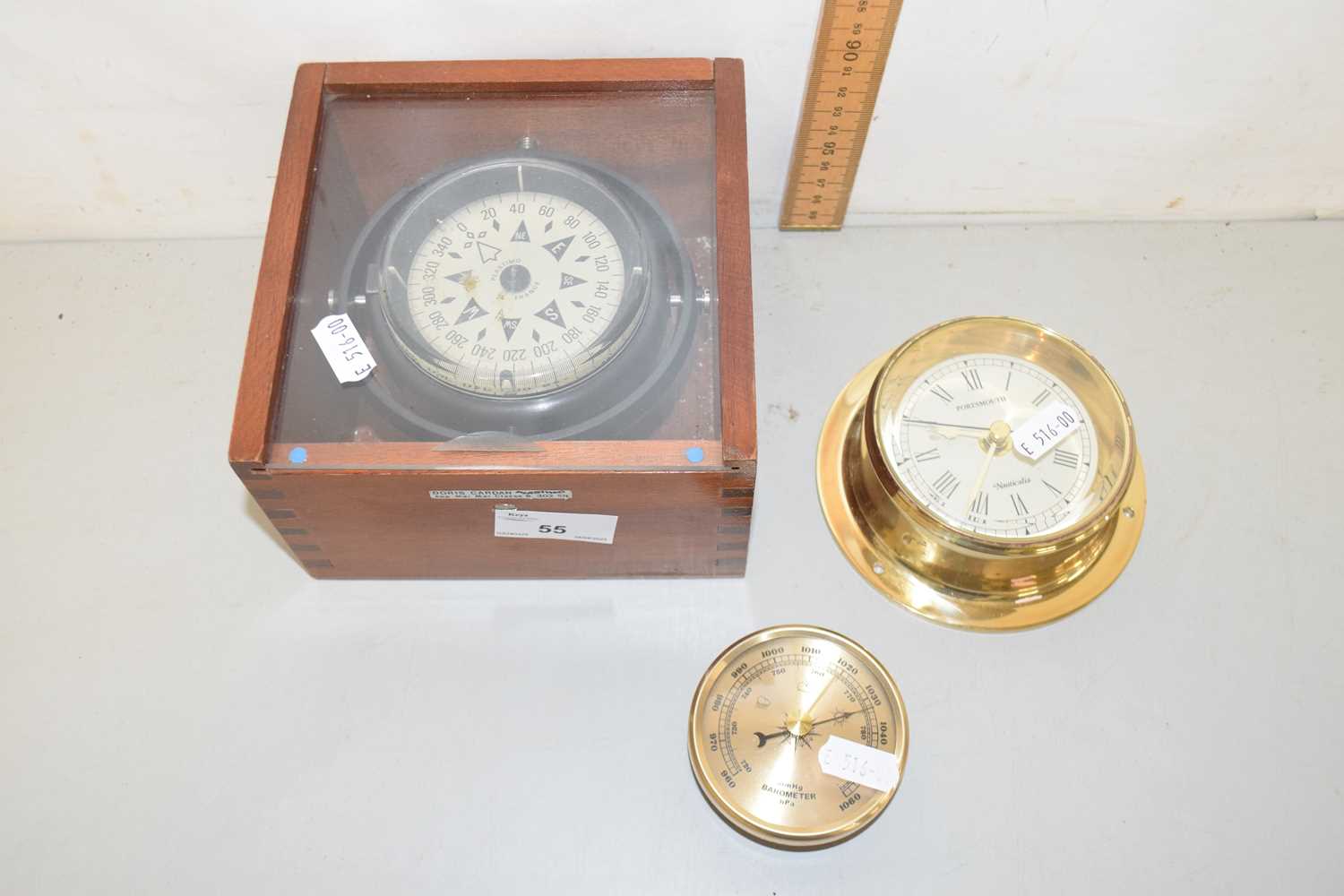 Lot 55 - A French Plastimo compass in hardwood case...