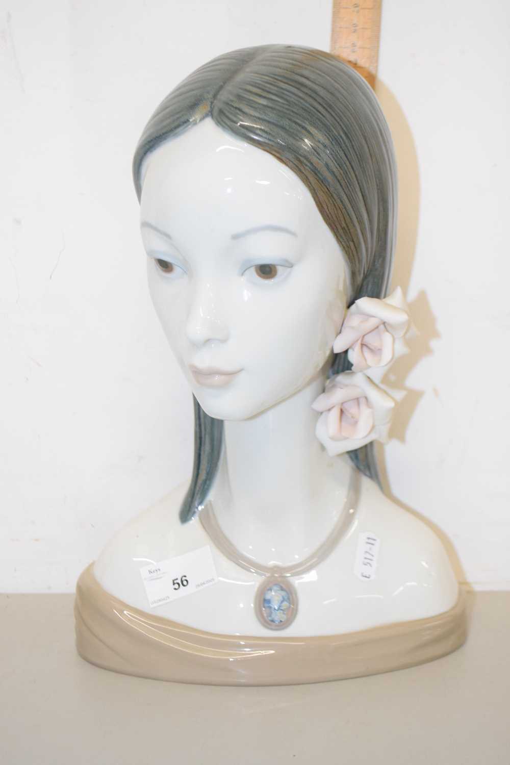 Lot 56 - A Lladro porcelain model of a young girl