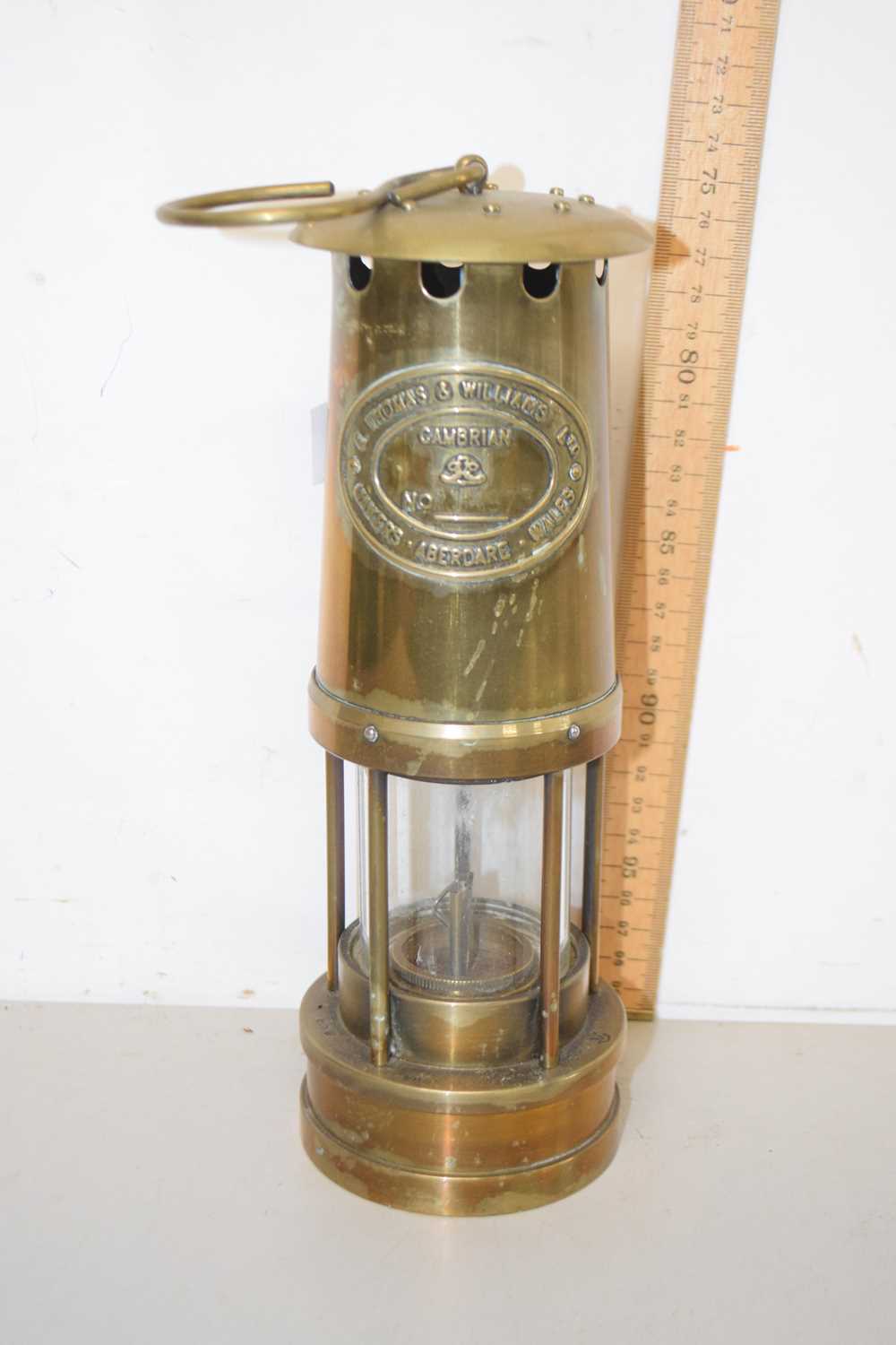 Lot 75 - A brass miners lamp marked Thomas & Williams