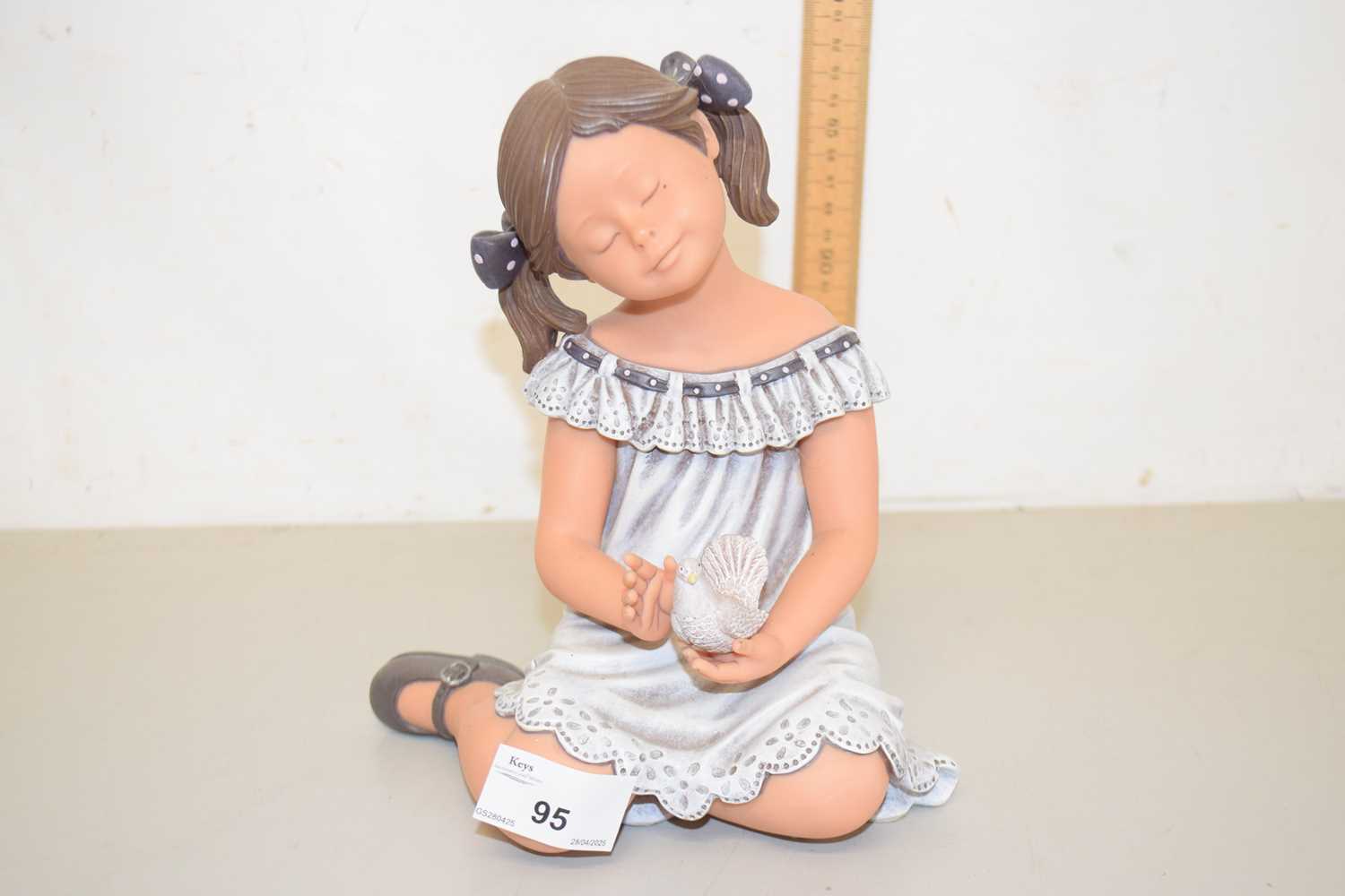 Lot 95 - A Nadal resin model of a girl with dove