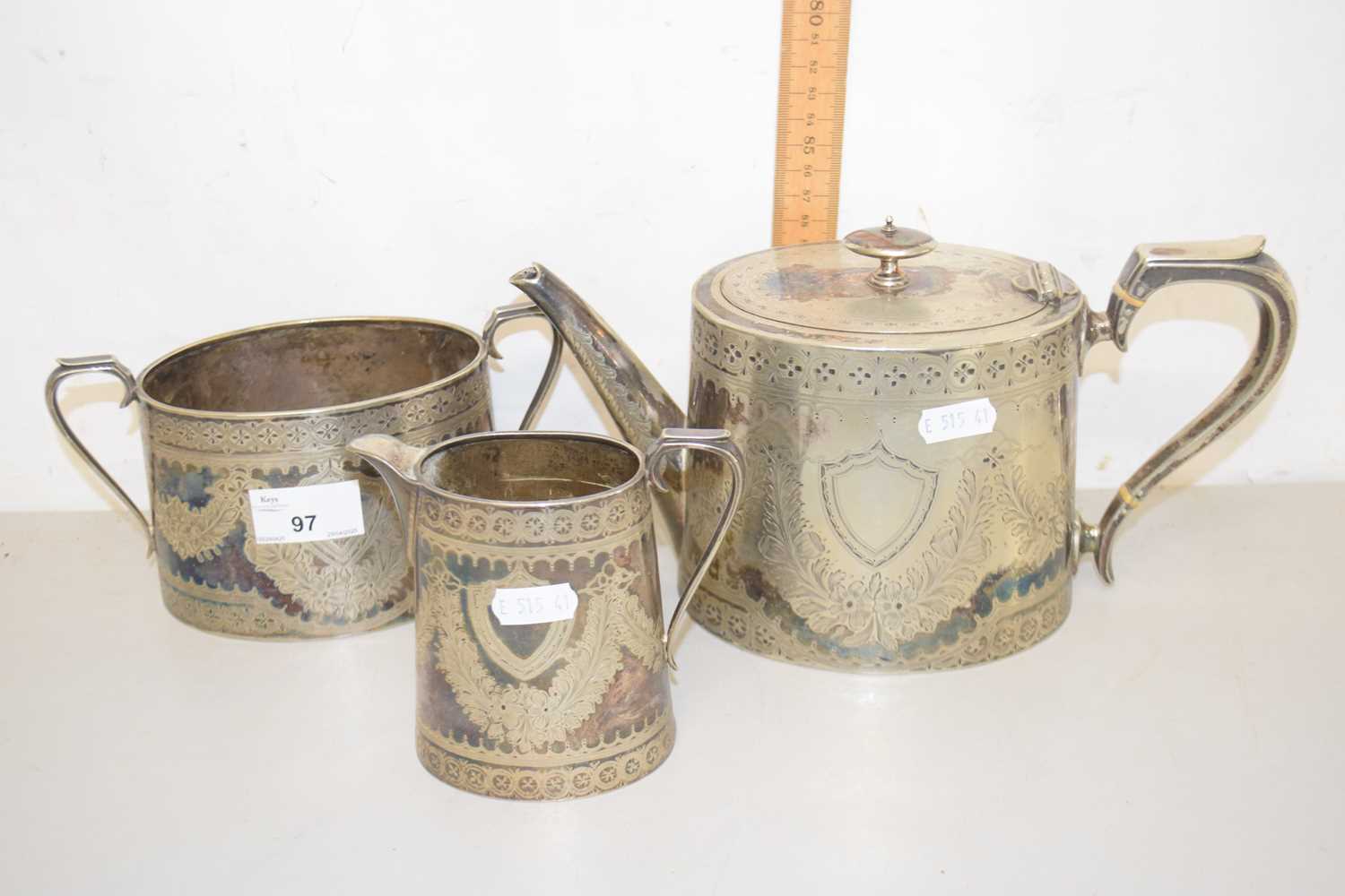 Lot 97 - A silver plated three piece tea set