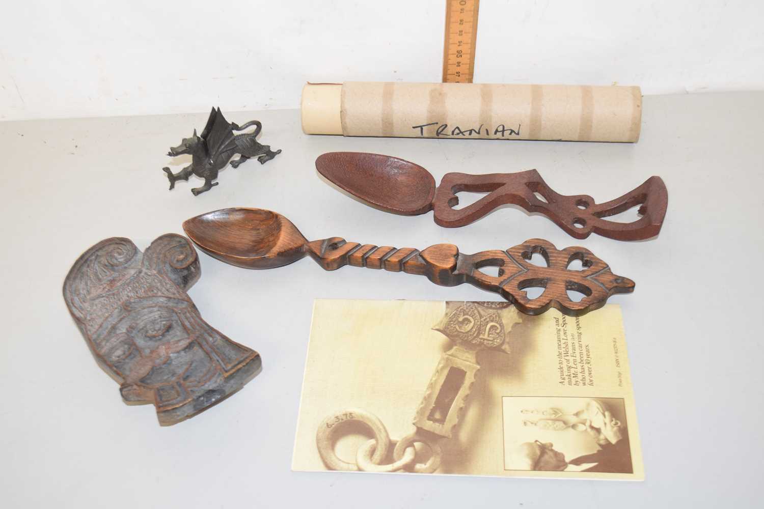 Lot 104 - Two reproduction Welsh love spoons together...