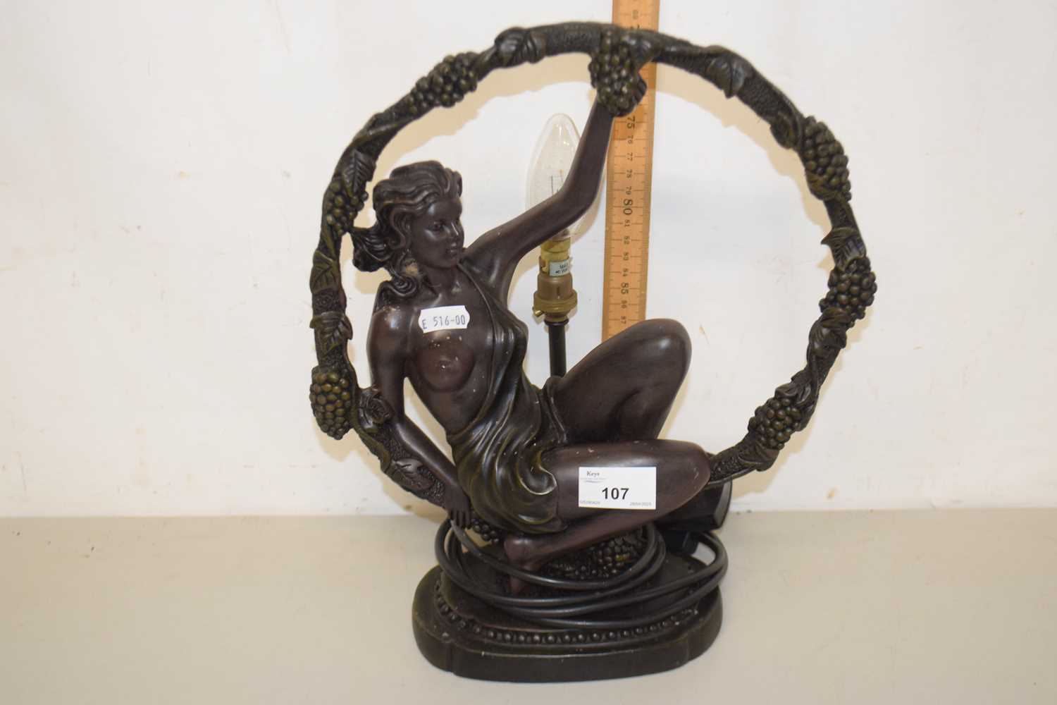 Lot 107 - A bronzed resin figural table lamp
