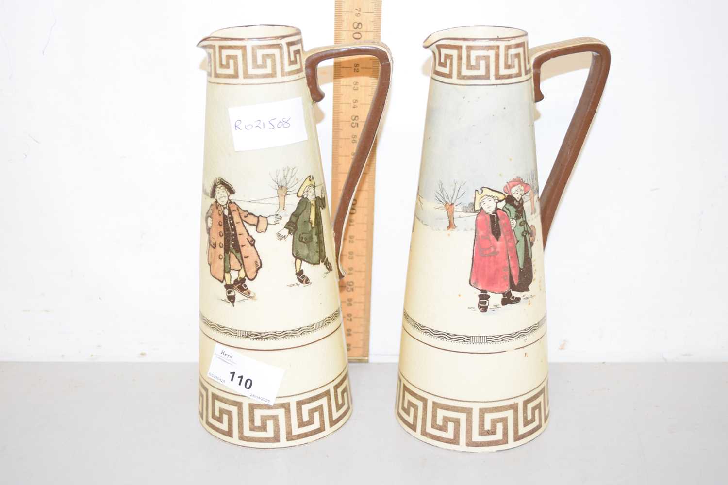 Lot 110 - A pair of Royal Doulton jugs decorated with...