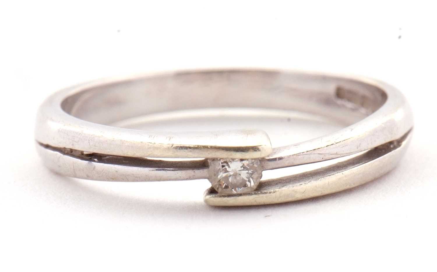 Lot 27 - A 9ct diamond ring, the central round...