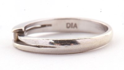 Lot 27 - A 9ct diamond ring, the central round...
