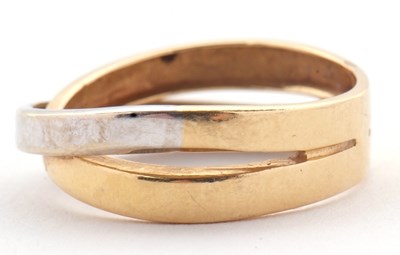 Lot 26 - A two tone gold ring, the white and yellow...