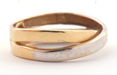 Lot 26 - A two tone gold ring, the white and yellow...