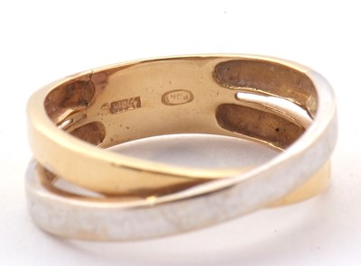 Lot 26 - A two tone gold ring, the white and yellow...
