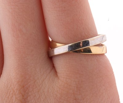 Lot 26 - A two tone gold ring, the white and yellow...