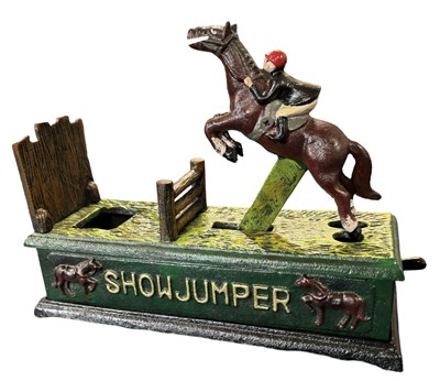 Lot 286 - A reproduction cast iron money box formed as a...
