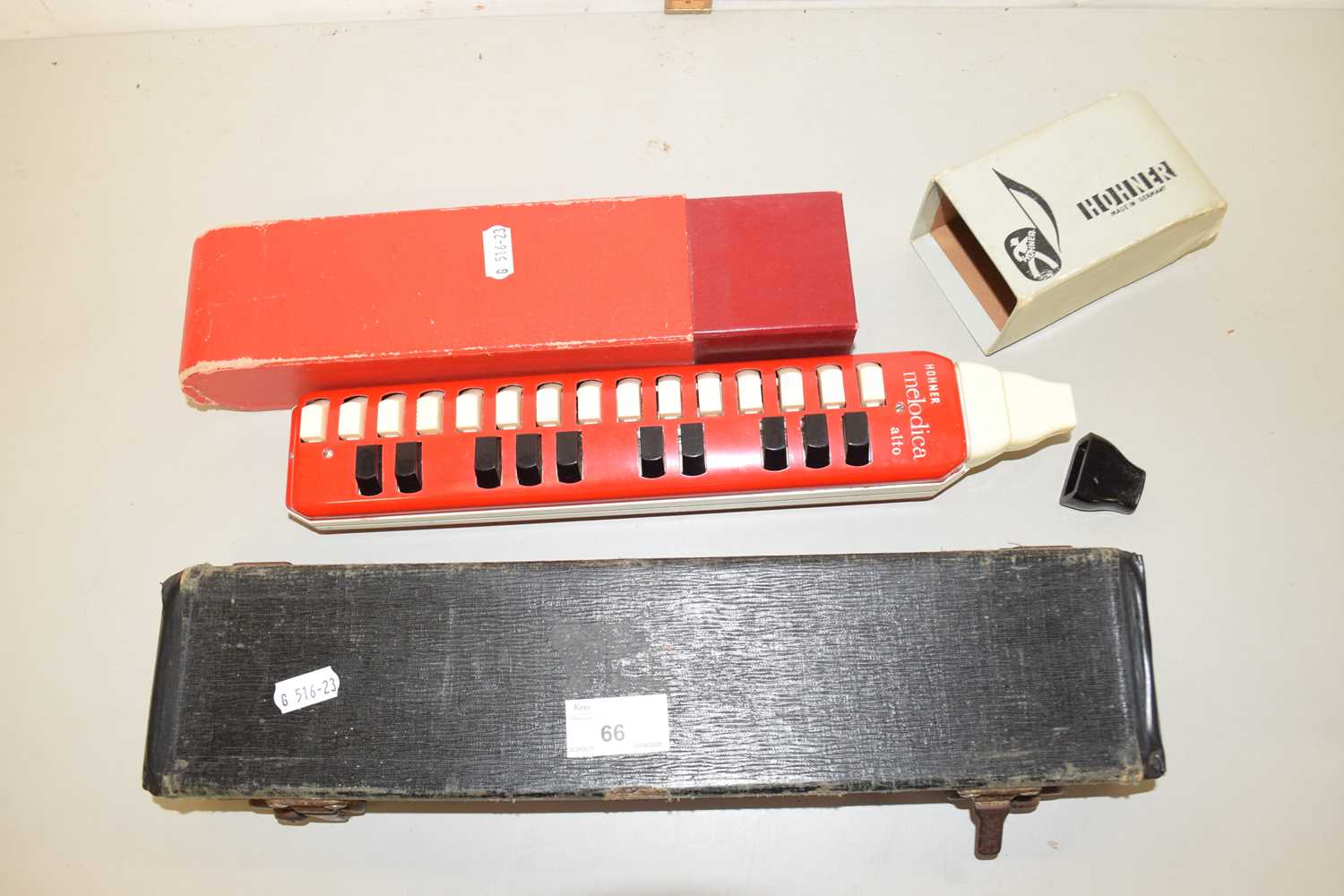 Lot 66 - A silver plated flute and a melodica