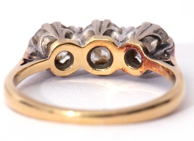 Lot 304 - Three stone diamond ring set with three...