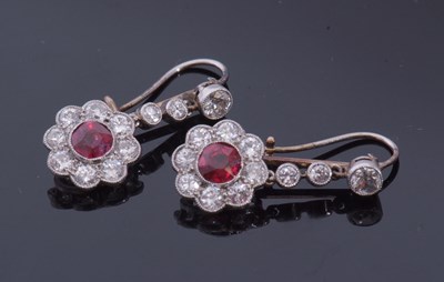 Lot 311 - Pair of ruby and diamond drop earrings...