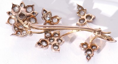 Lot 317 - Precious metal diamond set floral spray brooch,...