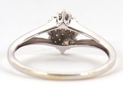 Lot 2 - A diamond cluster ring, the marquise shape...