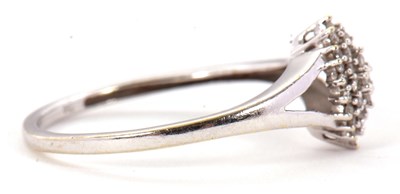 Lot 2 - A diamond cluster ring, the marquise shape...