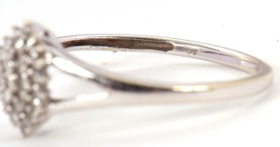 Lot 2 - A diamond cluster ring, the marquise shape...