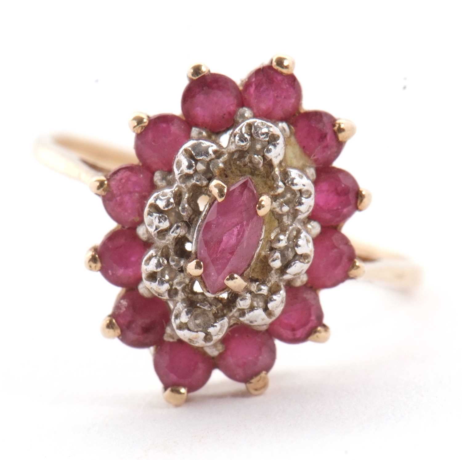 Lot 9 - A 9ct ruby and diamond cluster ring, the oval...