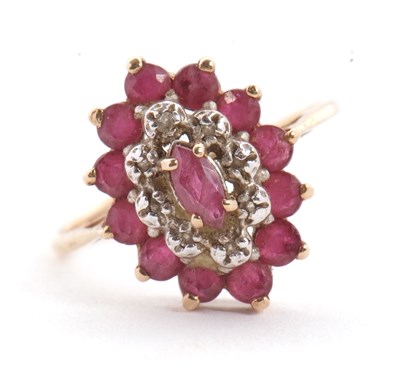 Lot 9 - A 9ct ruby and diamond cluster ring, the oval...