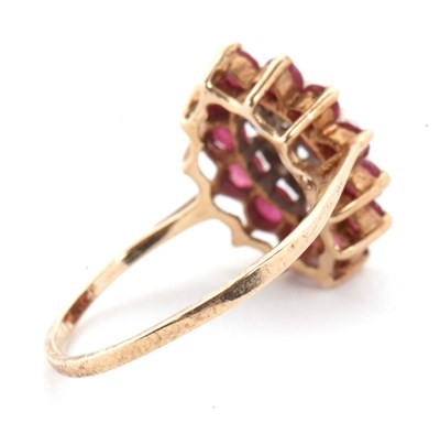 Lot 9 - A 9ct ruby and diamond cluster ring, the oval...