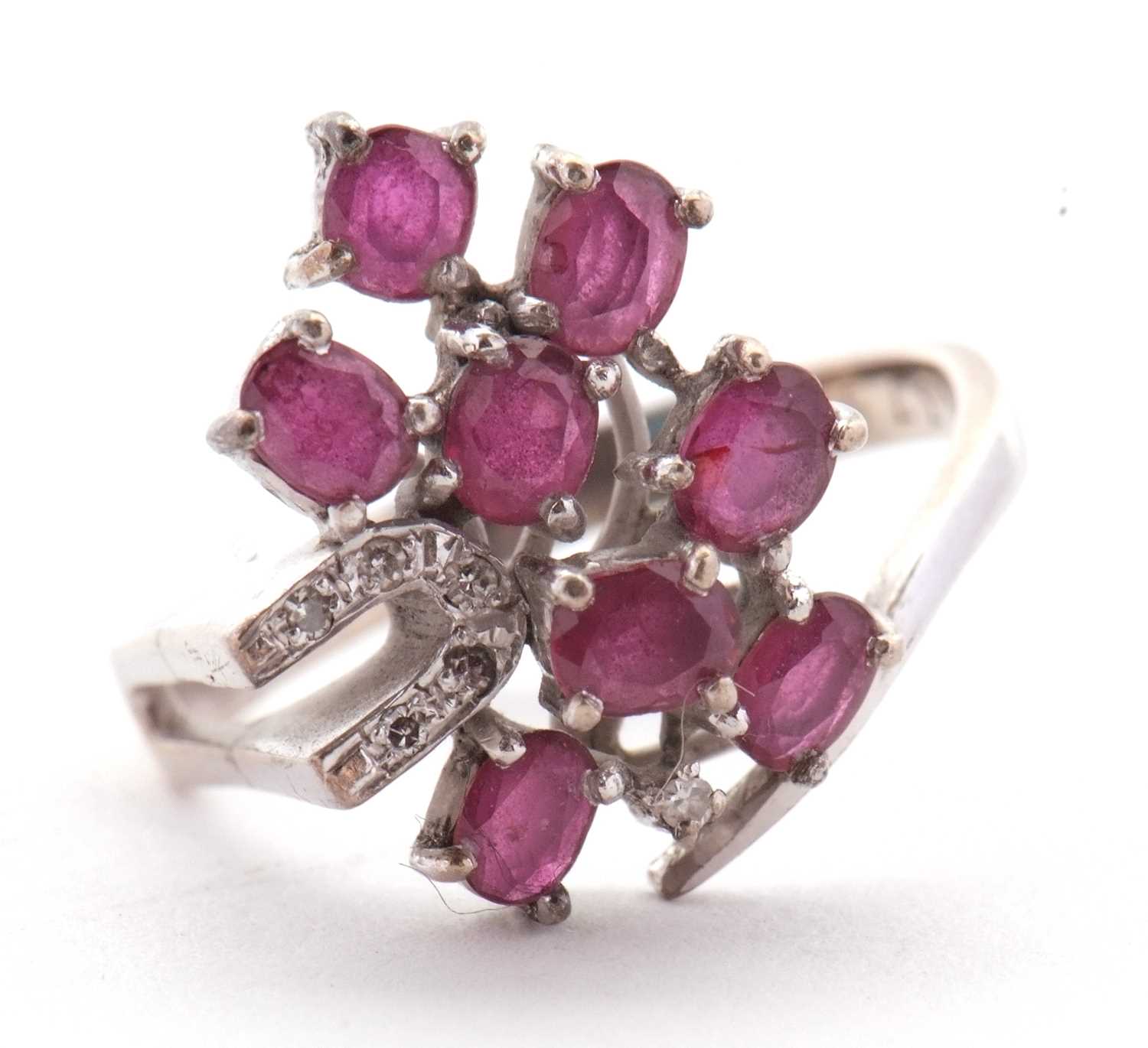 Lot 11 - A ruby and diamond ring, asymetrically set...