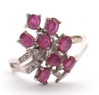 Lot 11 - A ruby and diamond ring, asymetrically set...
