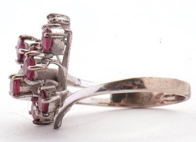 Lot 11 - A ruby and diamond ring, asymetrically set...