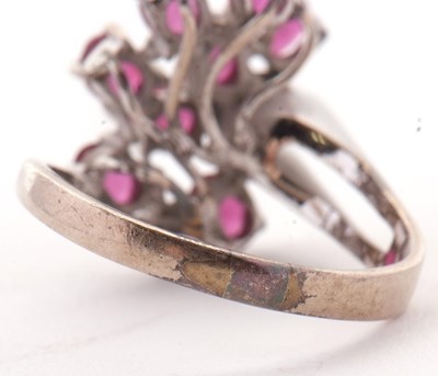 Lot 11 - A ruby and diamond ring, asymetrically set...