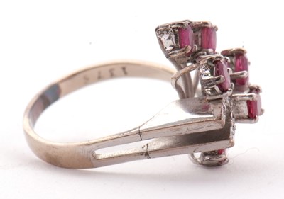Lot 11 - A ruby and diamond ring, asymetrically set...