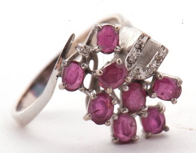 Lot 11 - A ruby and diamond ring, asymetrically set...