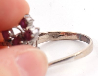 Lot 11 - A ruby and diamond ring, asymetrically set...