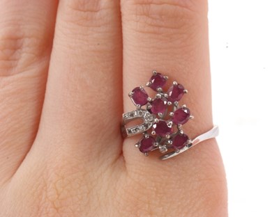 Lot 11 - A ruby and diamond ring, asymetrically set...