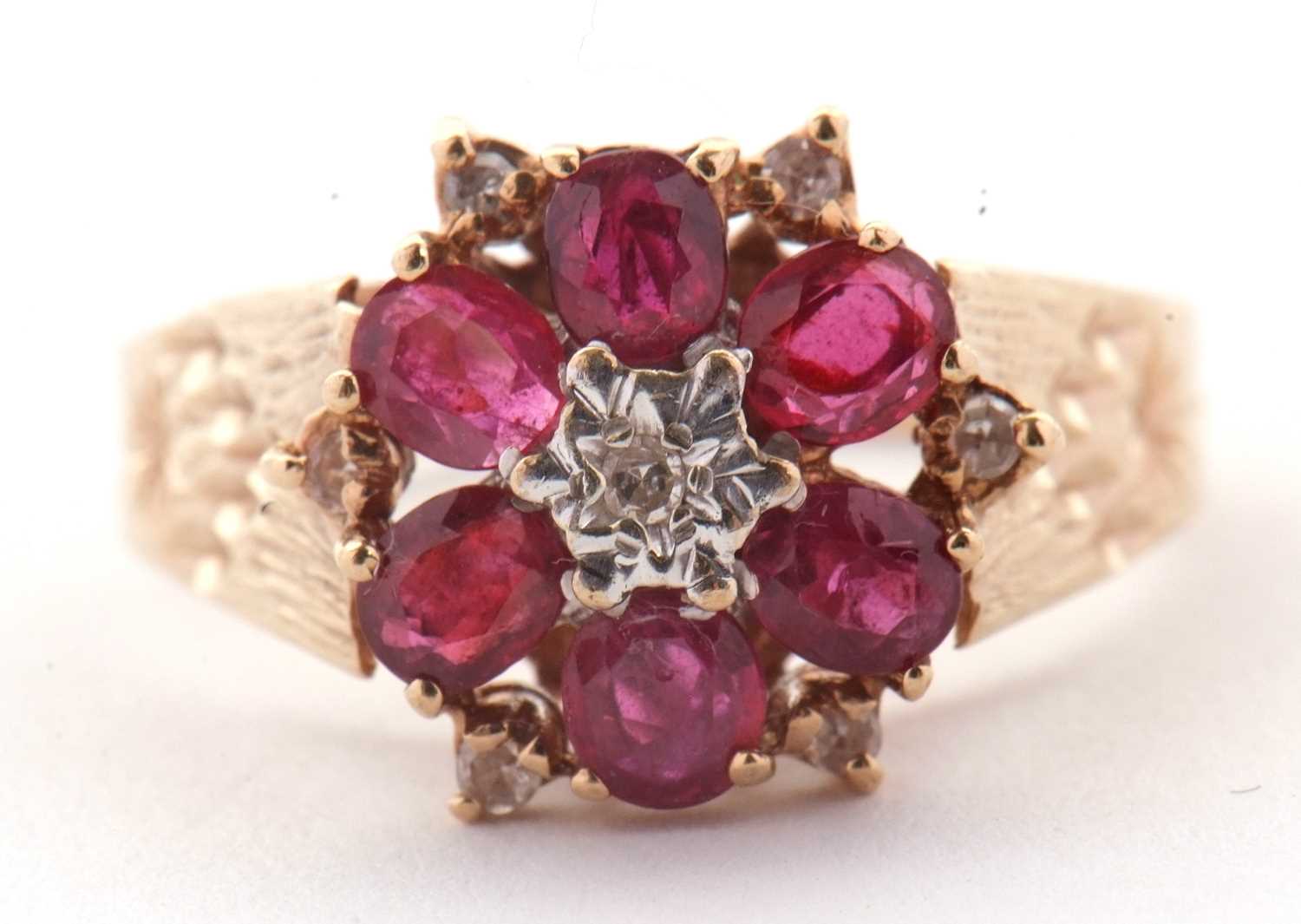 Lot 14 - A 9ct ruby and diamond ring, the central round...