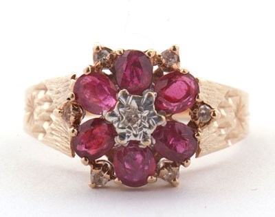Lot 14 - A 9ct ruby and diamond ring, the central round...