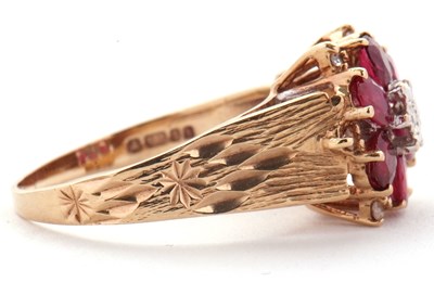 Lot 14 - A 9ct ruby and diamond ring, the central round...