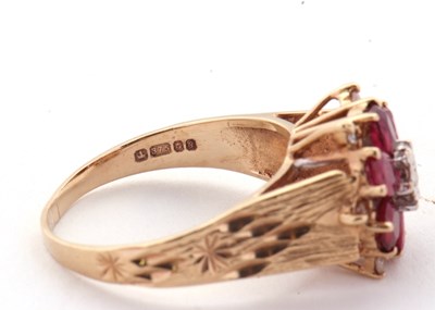 Lot 14 - A 9ct ruby and diamond ring, the central round...