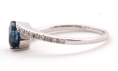 Lot 16 - A sapphire and diamond crossover ring, the...