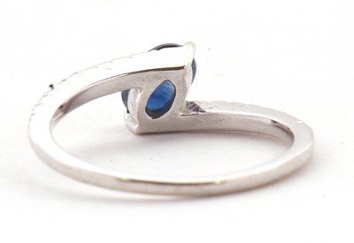 Lot 16 - A sapphire and diamond crossover ring, the...