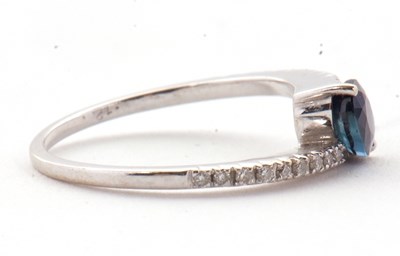 Lot 16 - A sapphire and diamond crossover ring, the...