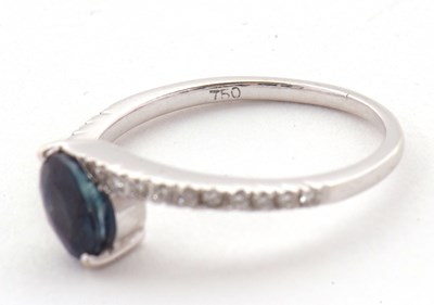 Lot 16 - A sapphire and diamond crossover ring, the...